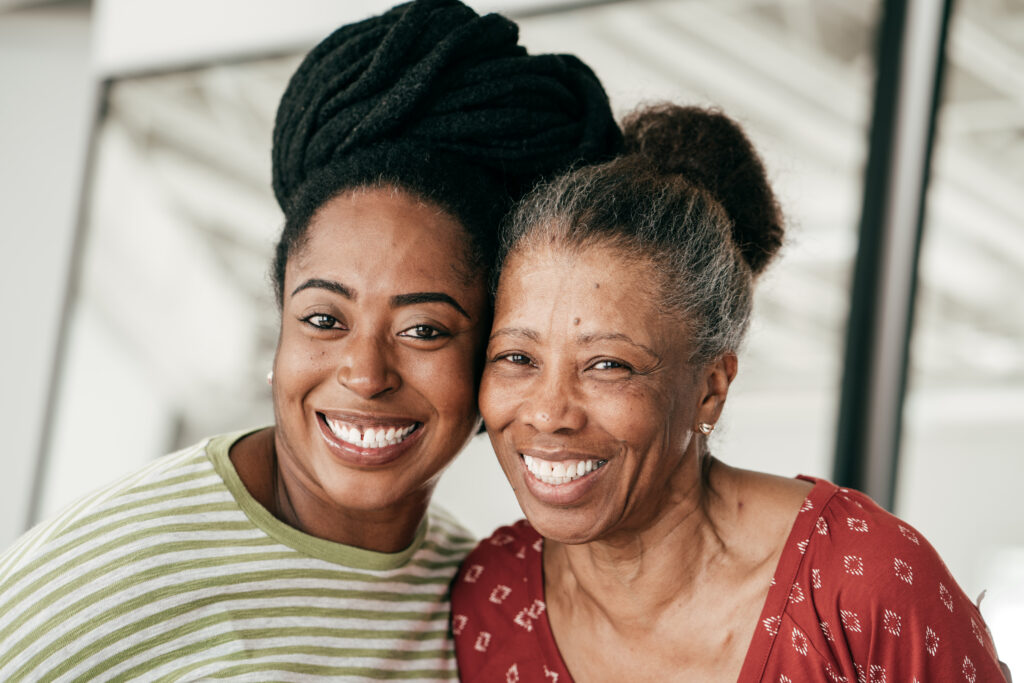 Two women smile together