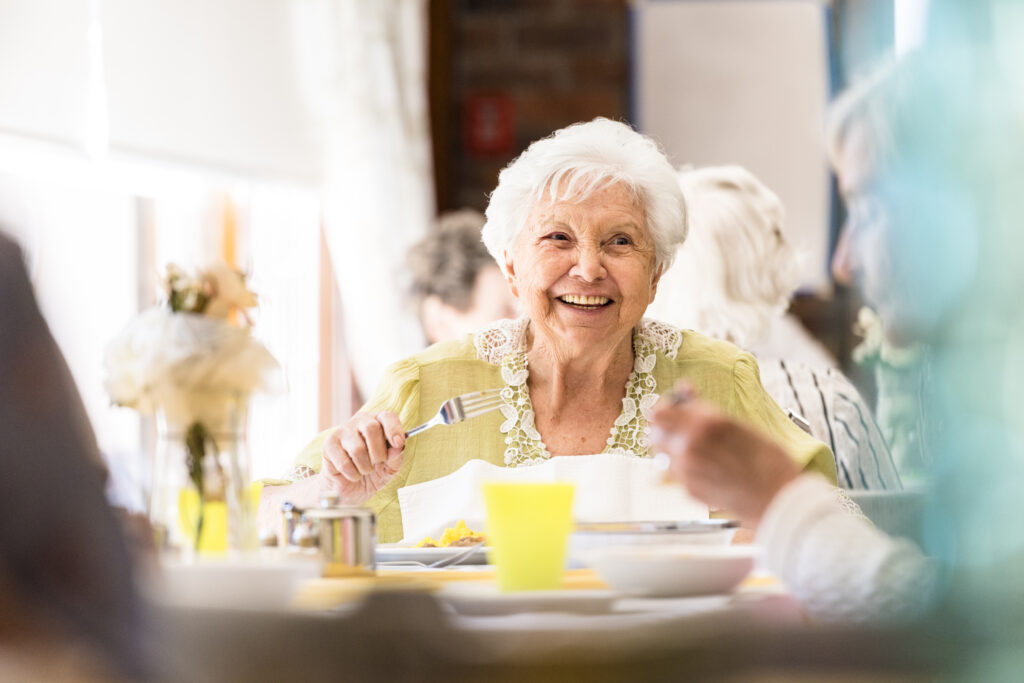 Portrait photo of a senior woman having lunch
