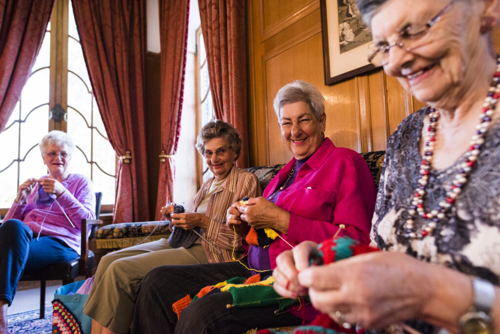 Older adult women knitting